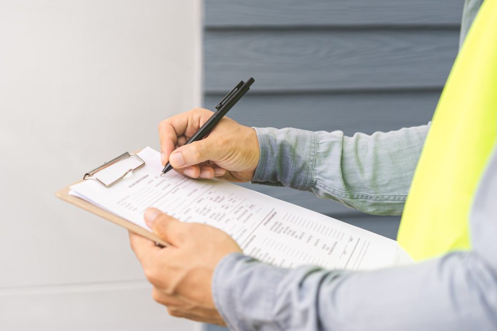 Plumber completing paperwork
